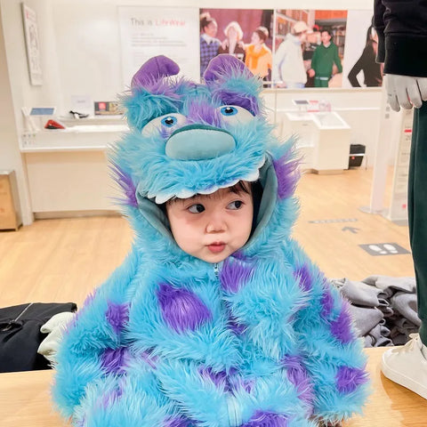 Baby wearing blue purple furry monster hooded jumpsuit