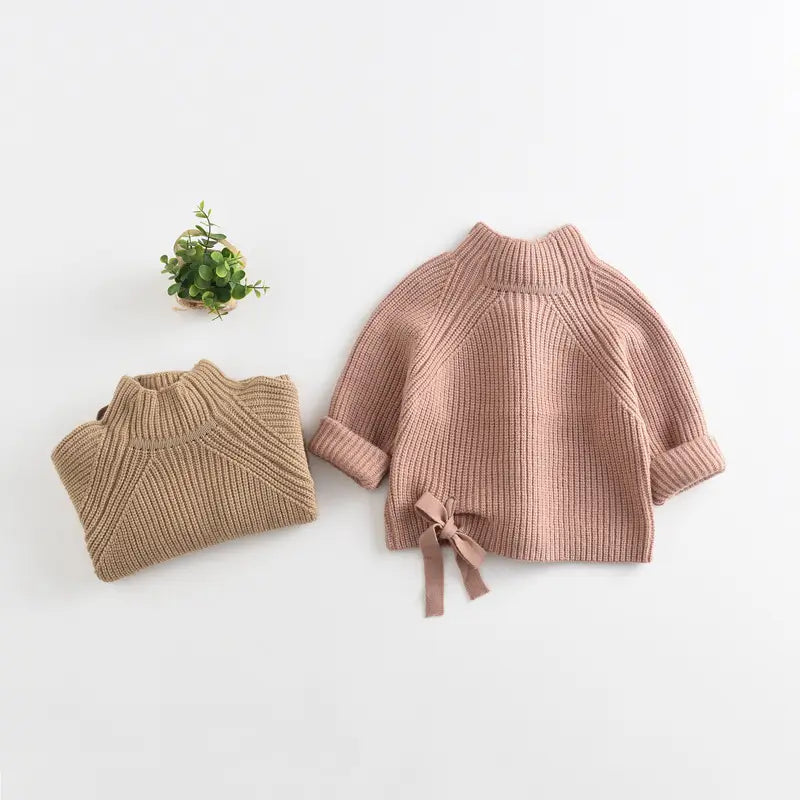 Girls' pink cotton knitted jumper with bow detail