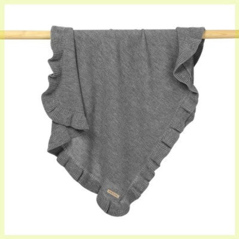 Grey knitted baby blanket with ruffle trim
