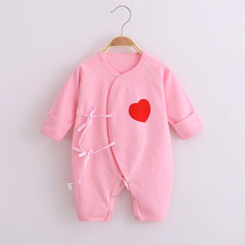Soft cotton baby romper with wrap front and tie fastening